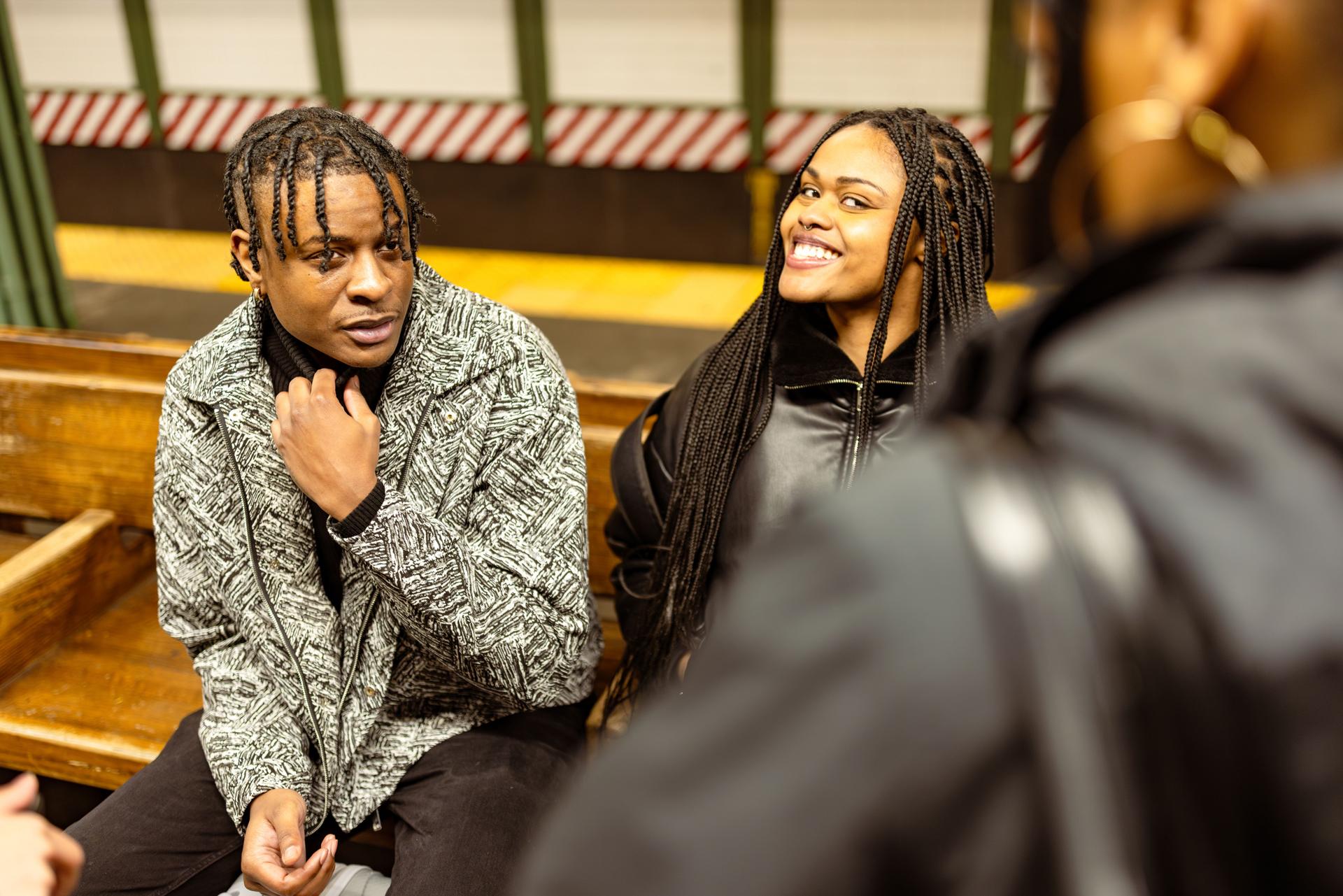 Diverse Students Engaging in Conversation at Subway Station